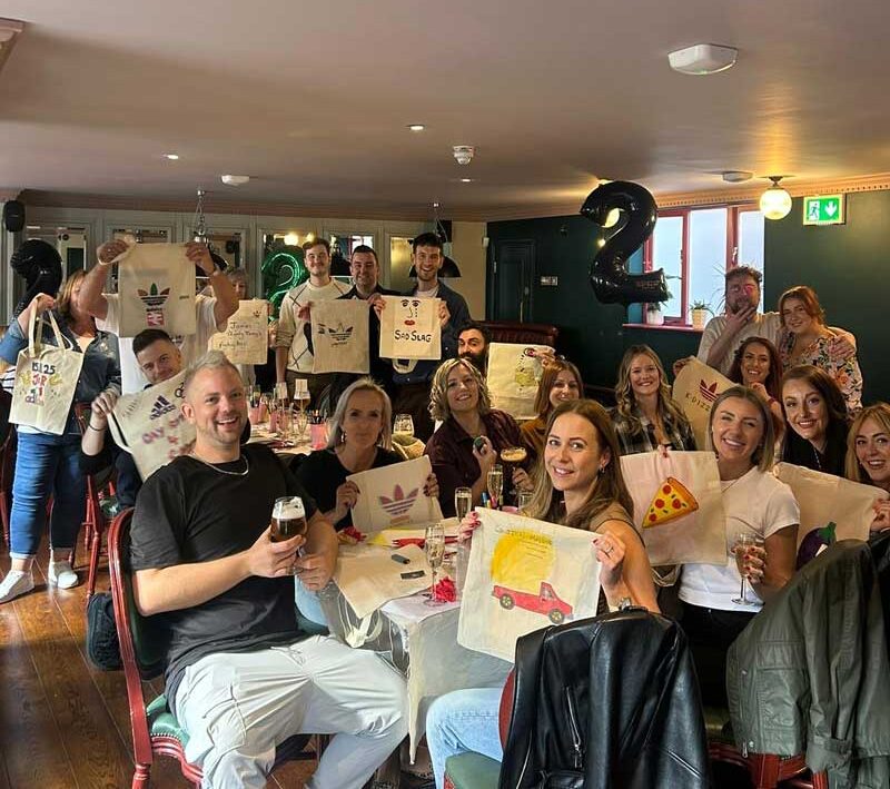 Group celebration with personalised prints in stockport