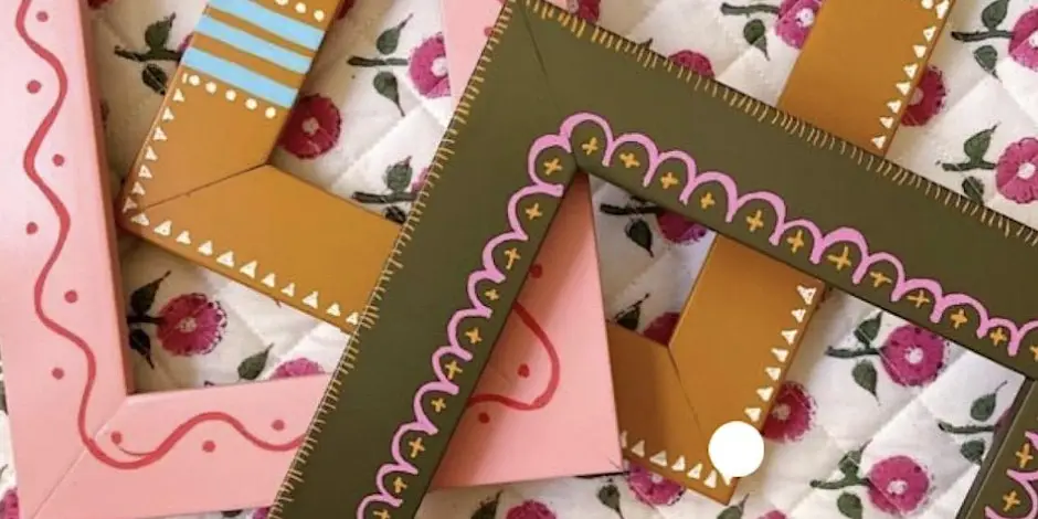 Colourful decorative photo frames arranged creatively